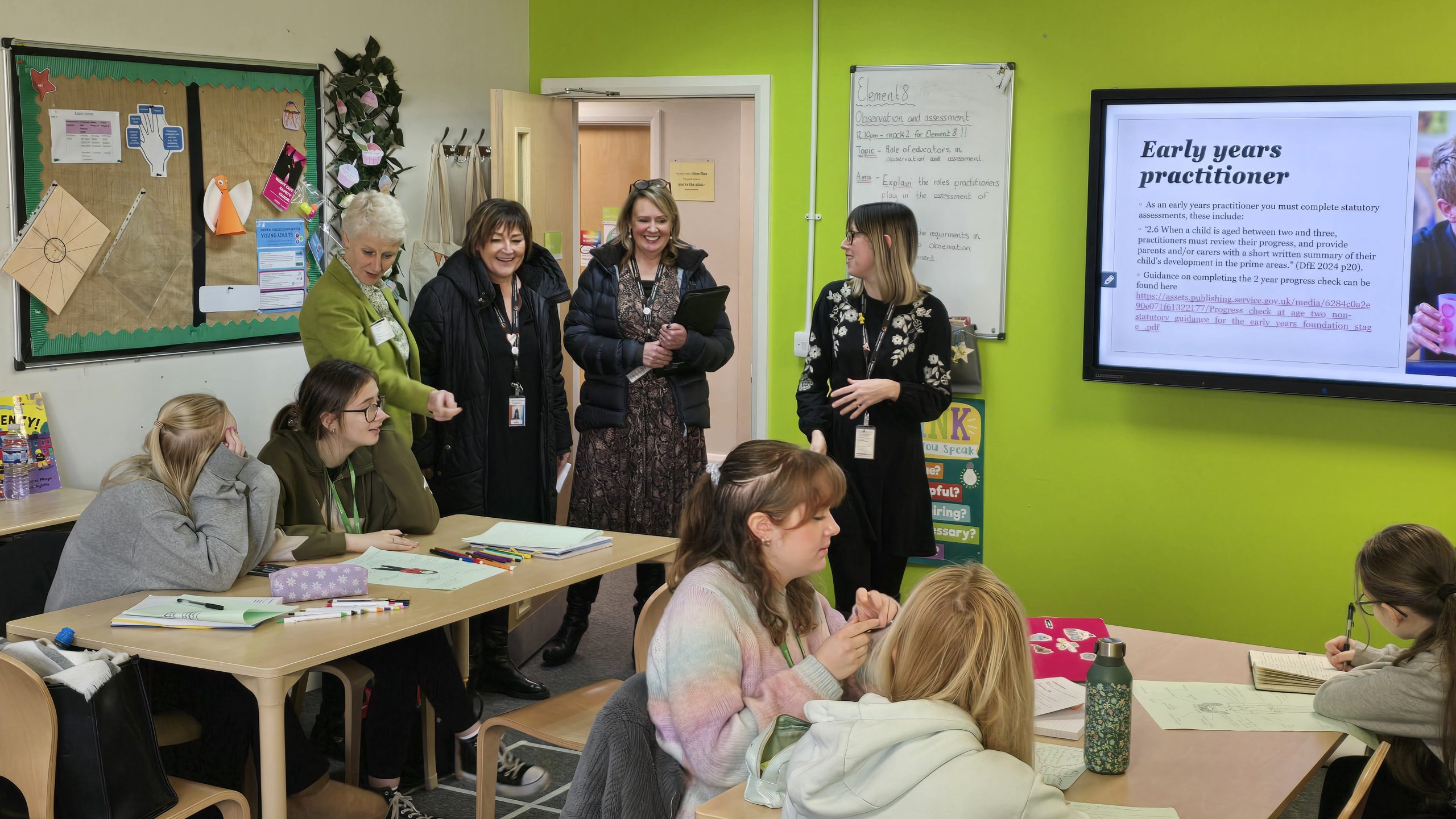 Shelagh chatting to students within the Care & Early Years Department